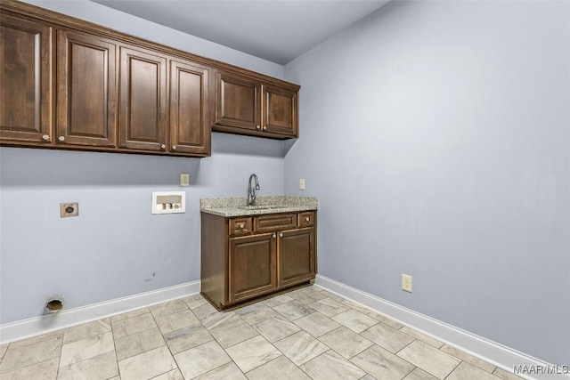 laundry room with cabinet space, baseboards, hookup for an electric dryer, washer hookup, and a sink