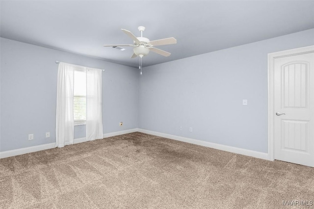 unfurnished room with ceiling fan, visible vents, baseboards, and carpet flooring