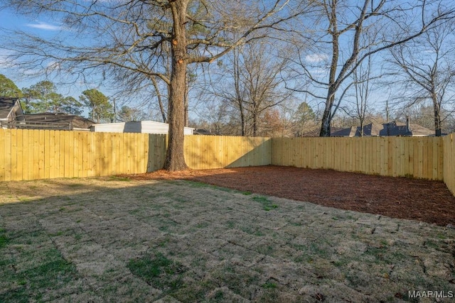 view of yard with a fenced backyard