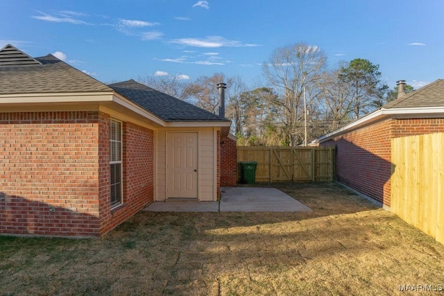 view of yard featuring a patio area and a fenced backyard