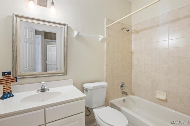 bathroom with toilet, vanity, and shower / tub combination