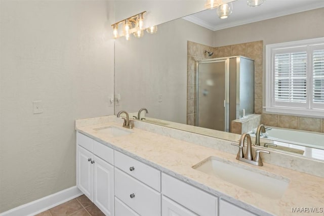 full bath featuring a stall shower, crown molding, and a sink