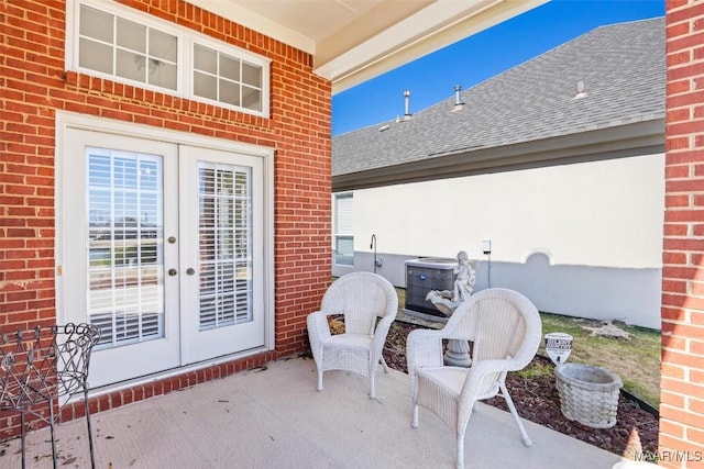 view of patio / terrace with central AC unit and french doors