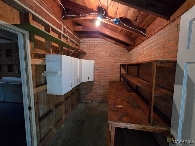 basement featuring wood ceiling and brick wall