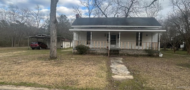 view of front of property with a porch and a front yard