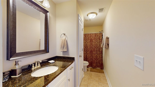 full bath with visible vents, toilet, vanity, tile patterned flooring, and baseboards