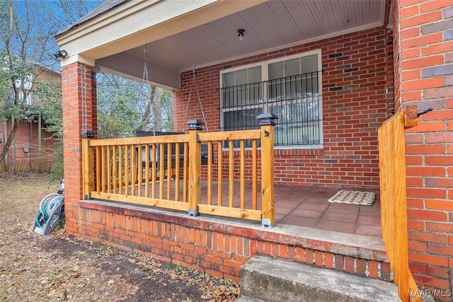 wooden terrace featuring a porch