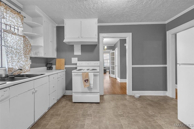 kitchen featuring open shelves, light countertops, white cabinetry, a sink, and white appliances