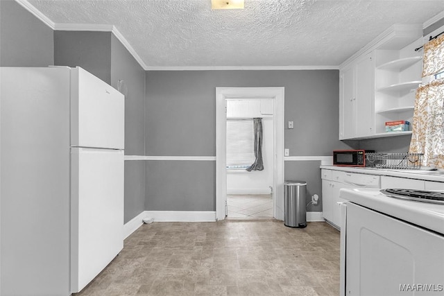 kitchen with open shelves, freestanding refrigerator, white cabinetry, black microwave, and range