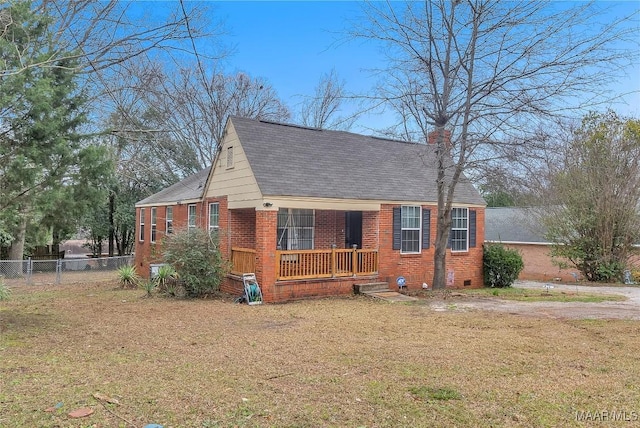 view of front of house with crawl space, a front lawn, and brick siding