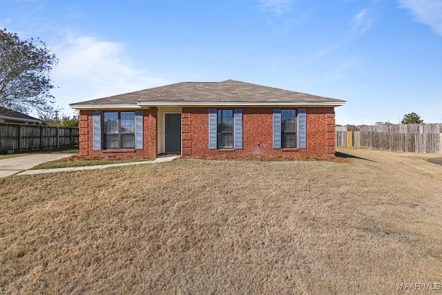 single story home featuring brick siding, a front yard, and fence