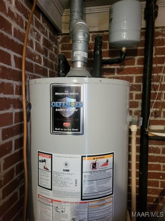 utility room featuring gas water heater