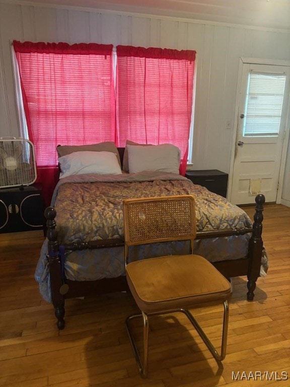 bedroom with wood finished floors