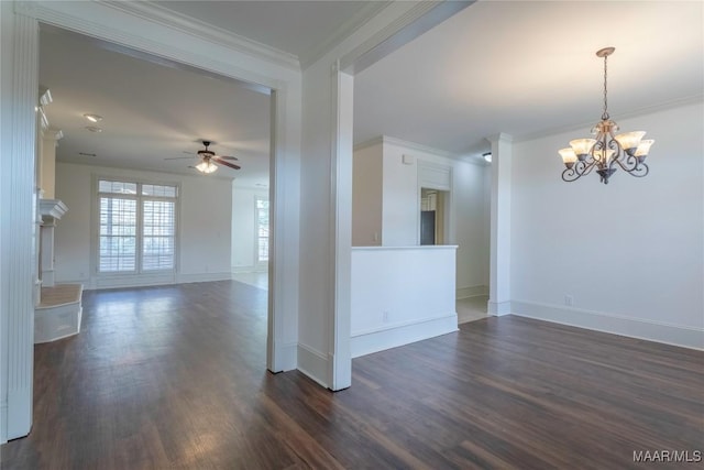 unfurnished room featuring dark wood-style floors, baseboards, crown molding, and ceiling fan with notable chandelier