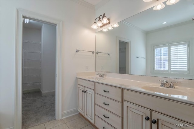 full bath featuring ornamental molding, double vanity, a sink, and tile patterned floors