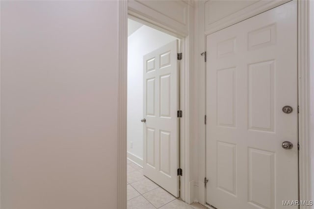 corridor with light tile patterned flooring