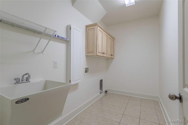 washroom featuring washer hookup, cabinet space, hookup for an electric dryer, a sink, and baseboards