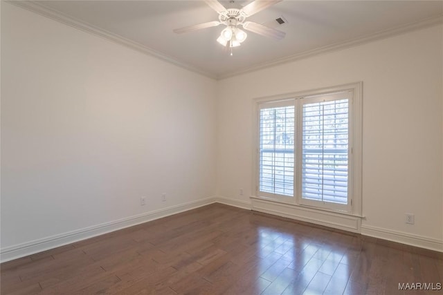 unfurnished room featuring baseboards, a ceiling fan, dark wood-style flooring, and crown molding