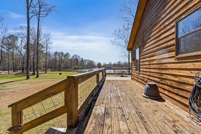 wooden deck featuring a water view