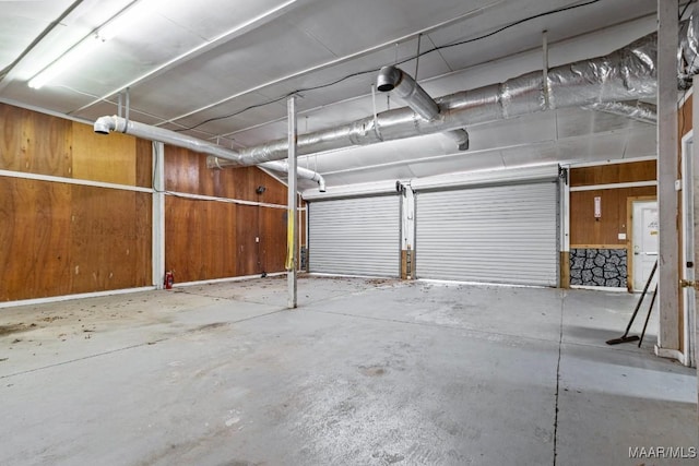 garage featuring wooden walls