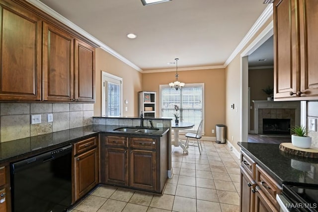 kitchen featuring black dishwasher, dark stone countertops, a peninsula, crown molding, and a sink