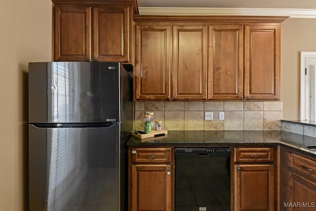 kitchen featuring freestanding refrigerator, brown cabinets, and dishwasher