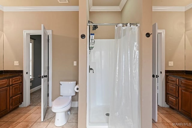 bathroom with toilet, a shower stall, ornamental molding, and vanity