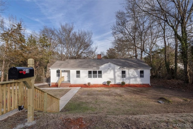 single story home with a chimney