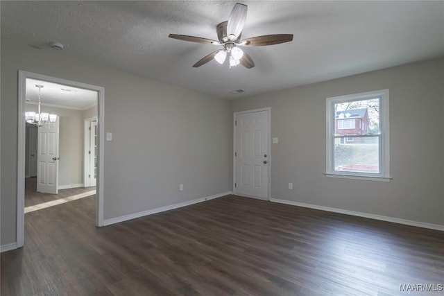 unfurnished room featuring dark wood-type flooring, baseboards, and ceiling fan with notable chandelier