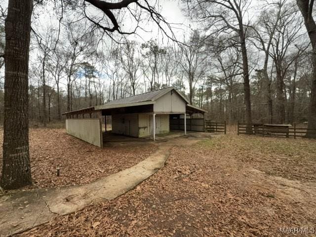 exterior space featuring an outbuilding and an exterior structure