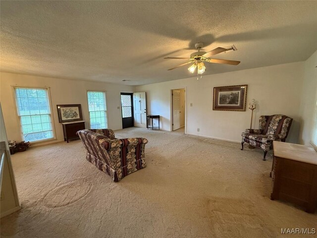 20 Glendale Dr, Selma, AL 36701 - living area featuring light carpet, a textured ceiling, baseboards, and ceiling fan