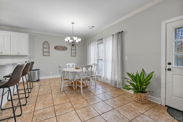 dining space with light tile patterned floors, ornamental molding, plenty of natural light, and a notable chandelier