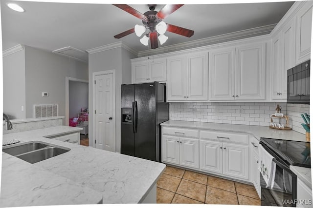 kitchen featuring black appliances, white cabinetry, visible vents, and a sink