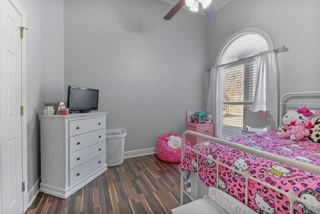 bedroom featuring dark wood-style floors, baseboards, and a ceiling fan