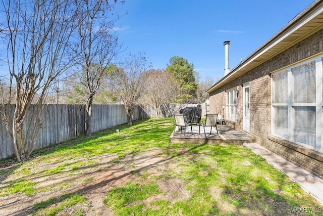 view of yard with a fenced backyard