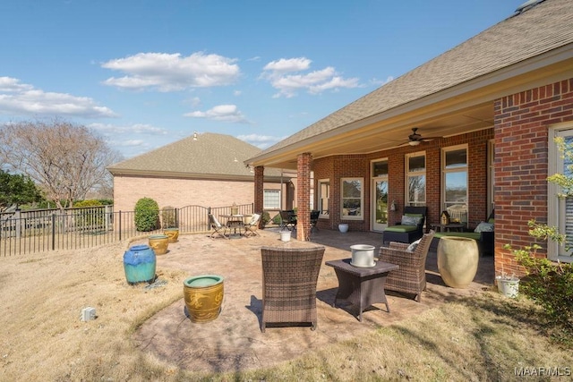 view of patio / terrace featuring ceiling fan and fence