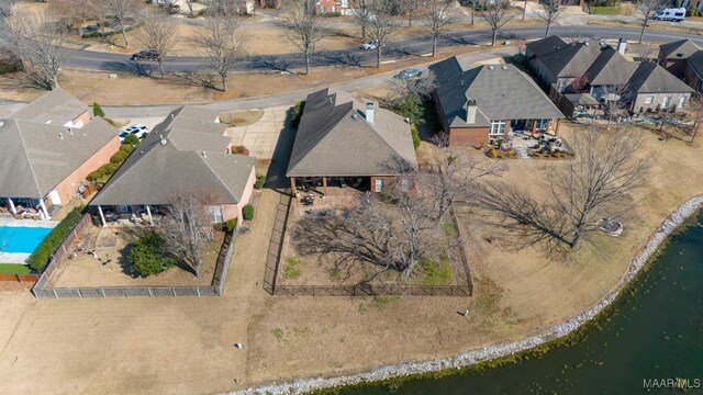 bird's eye view with a water view and a residential view