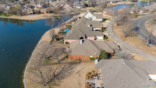 bird's eye view featuring a residential view and a water view