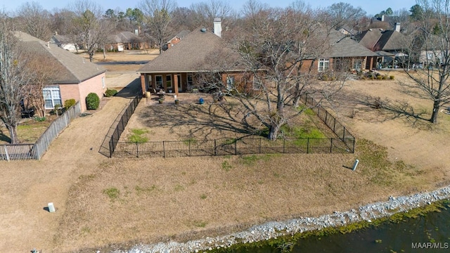 view of front of house featuring fence