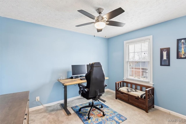 office area featuring a textured ceiling, carpet flooring, and baseboards