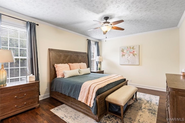 bedroom featuring a textured ceiling, dark wood-style flooring, ornamental molding, and multiple windows