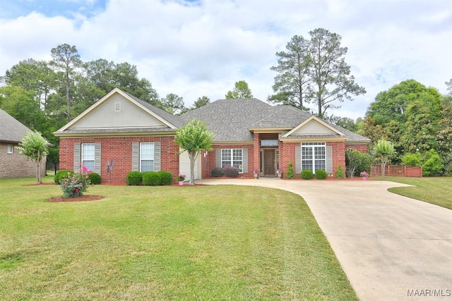 view of front facade with concrete driveway, a front lawn, and brick siding