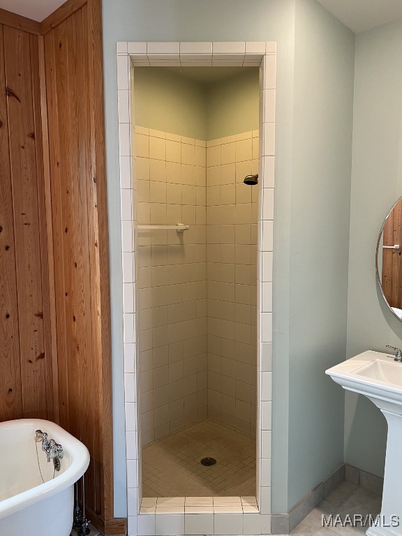 753 Bluff Rd, Rockford, AL 35136 - bathroom featuring a soaking tub, a shower stall, baseboards, and tile patterned floors