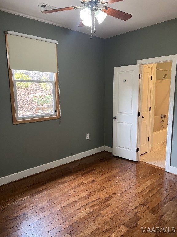 753 Bluff Rd, Rockford, AL 35136 - spare room featuring a ceiling fan, ornamental molding, baseboards, and wood finished floors