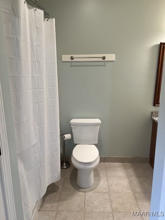 753 Bluff Rd, Rockford, AL 35136 - bathroom featuring tile patterned flooring, baseboards, vanity, and toilet