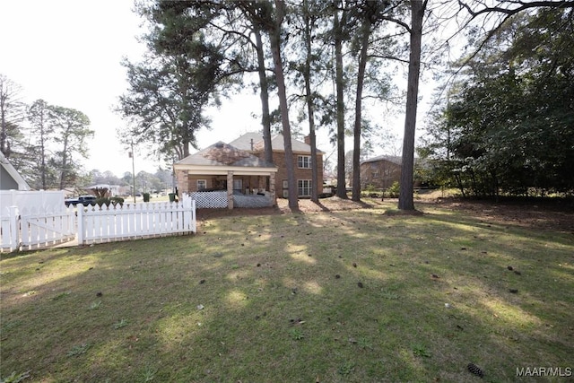 view of yard featuring fence