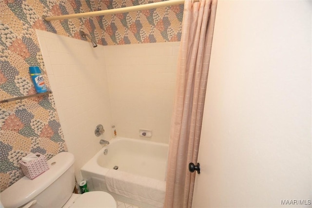 bathroom with toilet and shower / bath combo with shower curtain