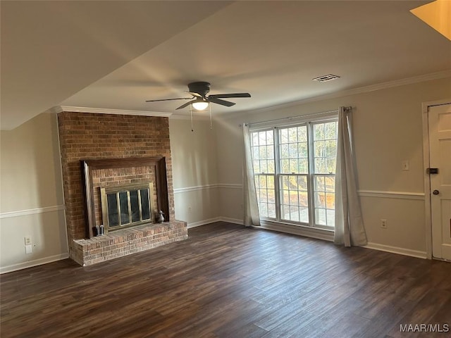 unfurnished living room with a fireplace, visible vents, crown molding, and wood finished floors