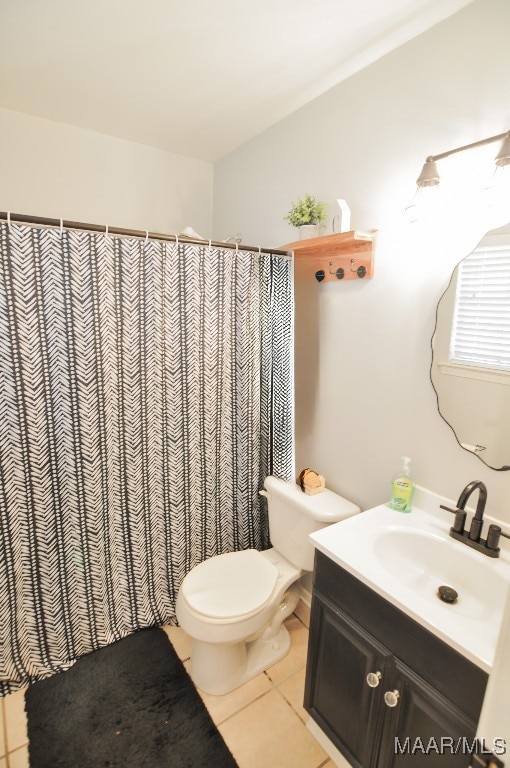 full bath featuring toilet, tile patterned floors, a shower with shower curtain, and vanity