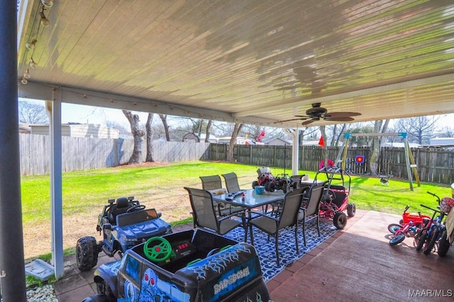 view of patio with ceiling fan, outdoor dining space, and a fenced backyard